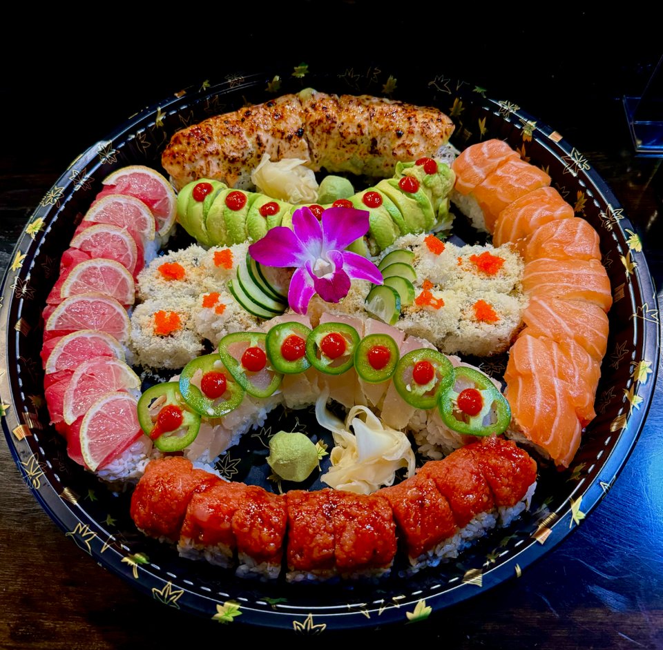 Sushi rolls on a casual dining table.